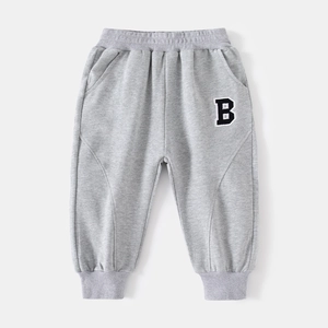 Classic grey cotton joggers for boys featuring a stylish letter B patch and elastic cuffs