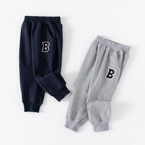 Boys' joggers in navy and grey with letter B patches and comfortable elastic waistbands