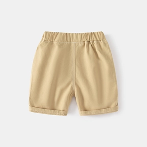 Detail of khaki boys' cotton shorts with elastic waistband and rolled-up cuffs