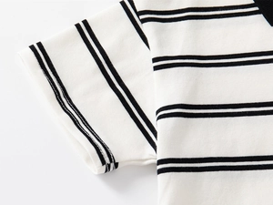 Detail shot of black and white striped cotton polo shirt shoulder and sleeve hem stitching
