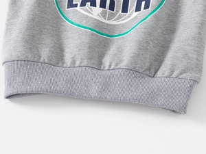 Detail of ribbed hem and Earth printed graphic on heather grey cotton sweatshirt