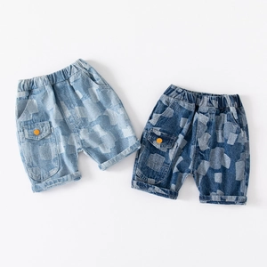 Detail of boys' denim shorts featuring cargo pockets and vintage checkered wash patterns