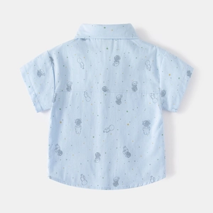 Kids short sleeve shirt in light blue with astronaut print for summer casual wear