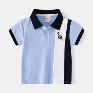 Kids short sleeve polo shirt in light blue with color block panels and rocket embroidery