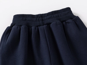 Detail view of boys elastic waist trousers with high-quality parallel stitching process