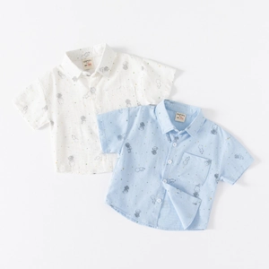 Detail of kids short sleeve shirts with cute astronaut prints and cotton texture