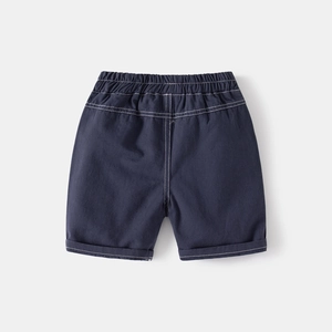 Close-up of boys casual navy shorts with elastic waistband and white contrast stitching