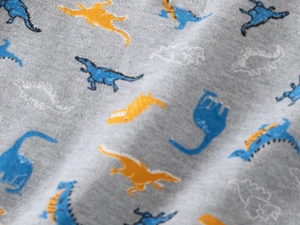 Detailed macro view of soft grey marl knit fabric with colorful cartoon dinosaur prints