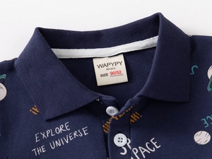 Close-up of navy blue cotton polo shirt with universe prints and buttoned collar detail