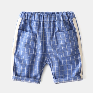 Detail of light blue checkered kids shorts with side stripes and double square pockets