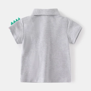 Boys grey polo shirt with cartoon dinosaur fin sleeves on a clean grey background