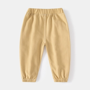 Close-up of khaki children trousers with elastic waistband and ribbed cuffs