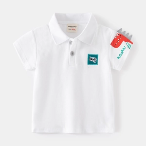 White cotton polo shirt for boys featuring a cartoon dinosaur on the sleeve and ROAR patch