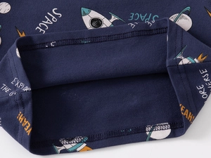 Detail of navy pique fabric with space prints and precise double-needle stitching