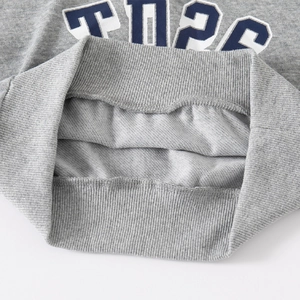 Light gray kids sweatshirt featuring ribbed hem detail and warm fleece lining