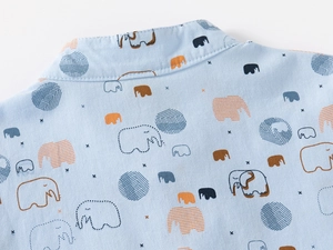 Detailed view of kids cotton shirt collar featuring colorful cartoon elephant prints