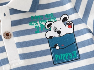 Detail of blue and white striped polo shirt with cartoon puppy print and brown button