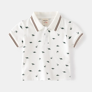 Kids white short sleeve polo shirt with green dinosaur and palm tree patterns
