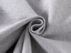 Macro shot of grey cotton knitted fabric showing texture and density of children polo shirt