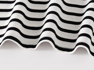 Detail of children's striped polo shirt showing the double-needle hem and knit texture