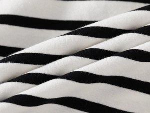 Close-up of premium black and white striped cotton fabric for kids polo t-shirt