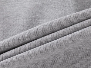 Detailed macro view showing the premium grey knitted fabric texture of the boys polo shirt