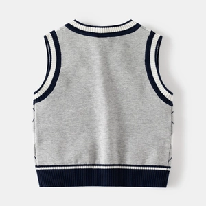 Detail view of the soft knitted texture and ribbed hem of the gray V-neck boys' sweater vest