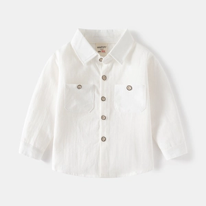 Flat lay of a white long-sleeved kids' shirt with dual chest pockets and wooden buttons