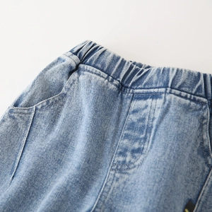 Boy's light blue denim pants featuring an elastic waist and high-quality washed texture