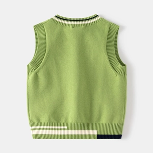 Detail of green V-neck knit vest featuring ribbed striped neckline and contrast hem