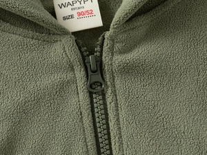 Close-up of durable plastic zipper and soft olive green polar fleece texture on kids jacket