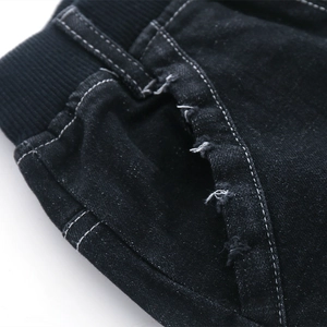 Kids black denim pants with elastic waist and distressed pocket details in street style