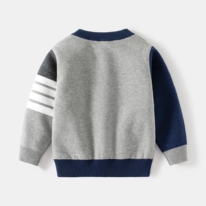 Back view of children's grey knit sweater with contrast navy sleeves and white stripes