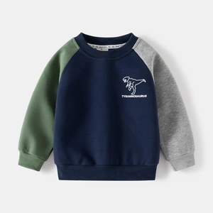 Detail of color-block dinosaur sweatshirt with navy body, green and grey sleeves