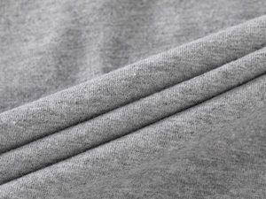 Close-up of gray knitted fabric texture showing premium fiber detail and soft material