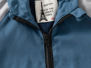 Detail view of child hoodie with blue windproof fabric and warm fleece lining