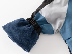 Macro detail of toddler jacket with fleece lining and windproof elastic cuffs