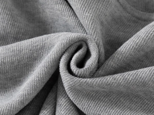 Macro shot of grey ribbed knit fabric showing soft texture and elastic material details