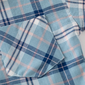 Classic blue plaid cotton long sleeve shirt for boys featuring a functional front pocket