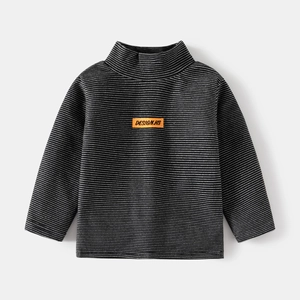 Detail view of children stripe long sleeve shirt with orange label and turtle neck