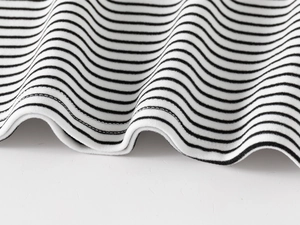 Detail of black and white striped knit fabric with professional double-needle stitching