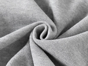 Close-up of grey knitted fabric texture on the kid's sweatshirt showing ribbed detail
