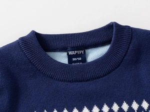 Detail shot of navy blue kids knit sweater with ribbed neckline and diamond pattern