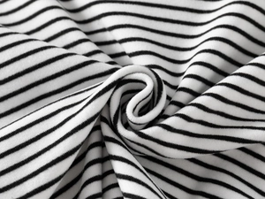 Macro shot of soft black and white striped fabric texture and elastic knit material