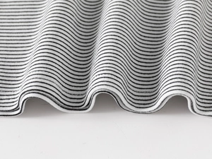 Detail of high-quality double-stitch hem on kids striped thermal turtleneck shirt