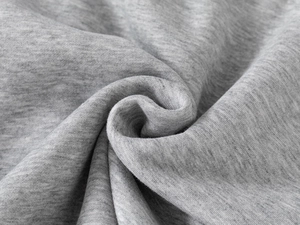 Macro shot of grey marl knitted fabric texture for children's baseball jackets