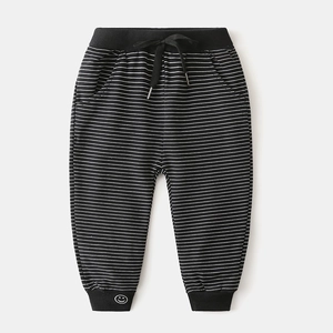 Kids black and white striped joggers with elastic waist and cute smiley face print
