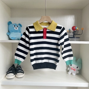 Kids long sleeve polo neck sweater featuring bold black and white stripes and colorful collar
