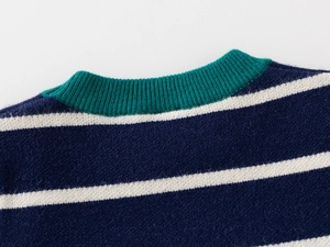 Detail of navy stripe sweater showing green ribbed neckline and soft knit texture