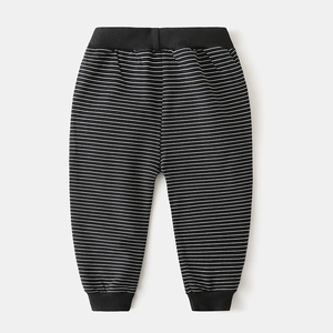 Detail of boys' striped cotton pants showing elastic waistband and ribbed ankle cuffs